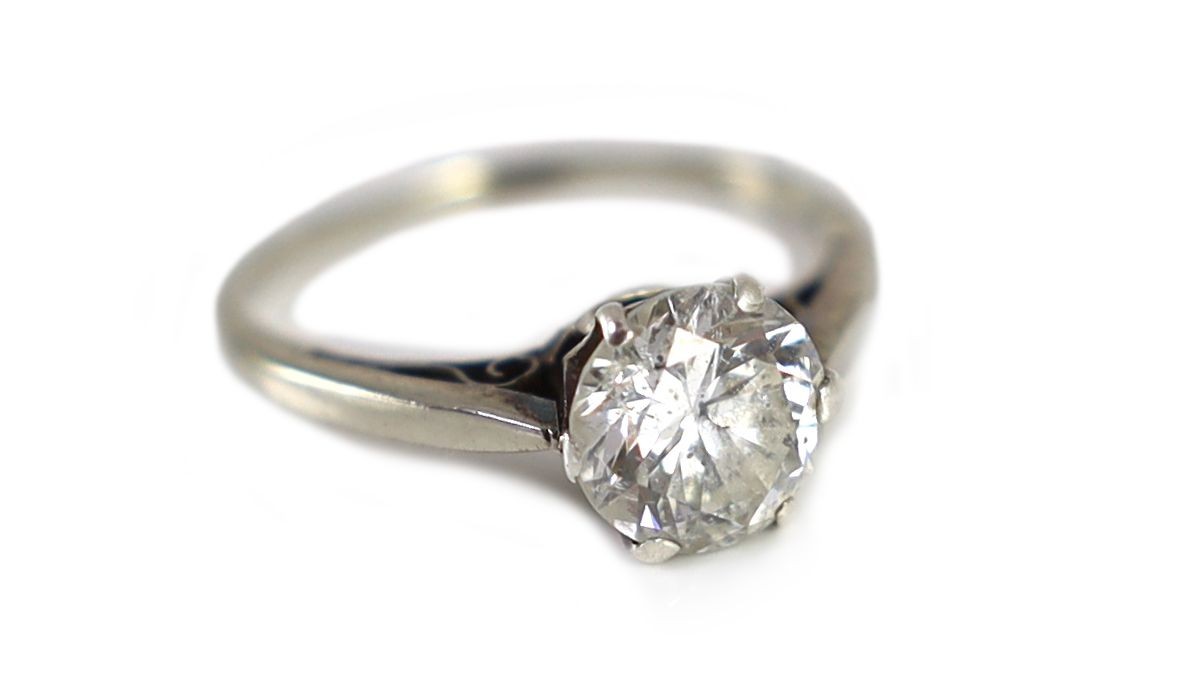 A 9ct white gold and solitaire diamond ring